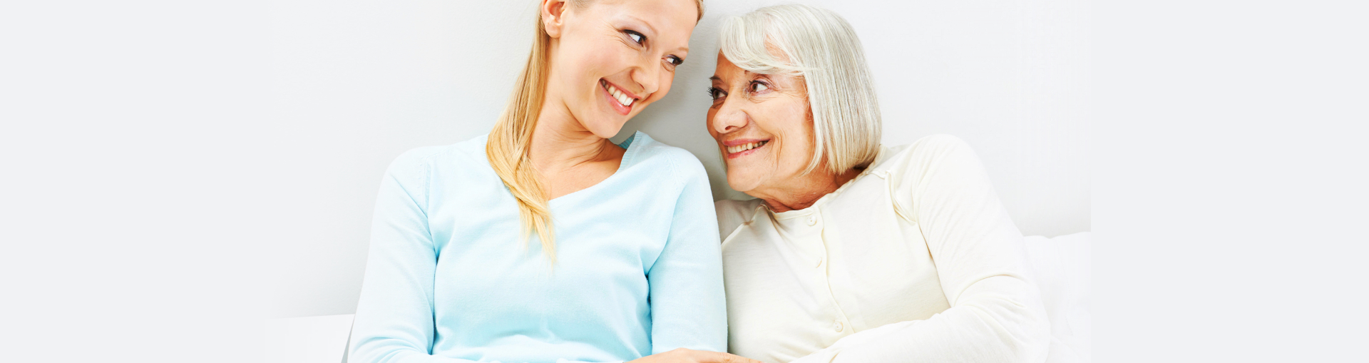 woman and old woman smiling